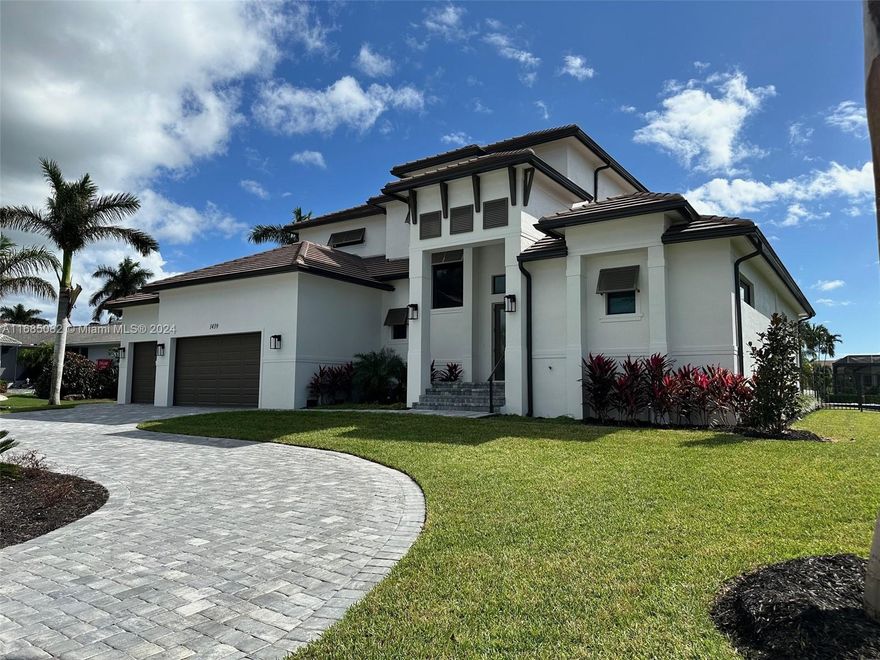 Welcome to your dream home in Marco Island, FL! The expansive living areas are bathed in natural light, showcasing elegant finishes and thoughtful design throughout. The kitchen flows seamlessly into the dining and lounge areas, creating a perfect space for gatherings. A large walk-in pantry with shelving is conveniently located in the kitchen. The primary suite is a true retreat, featuring double doors that open to your private pool.  The en-suite bathroom boasts double sinks, multiple shower heads, and a striking stand-alone tub that serves as the centerpiece. This waterfront gem offers a rare opportunity to embrace the Marco Island lifestyle. Don’t miss your chance to experience this exceptional property—schedule your private showing today!