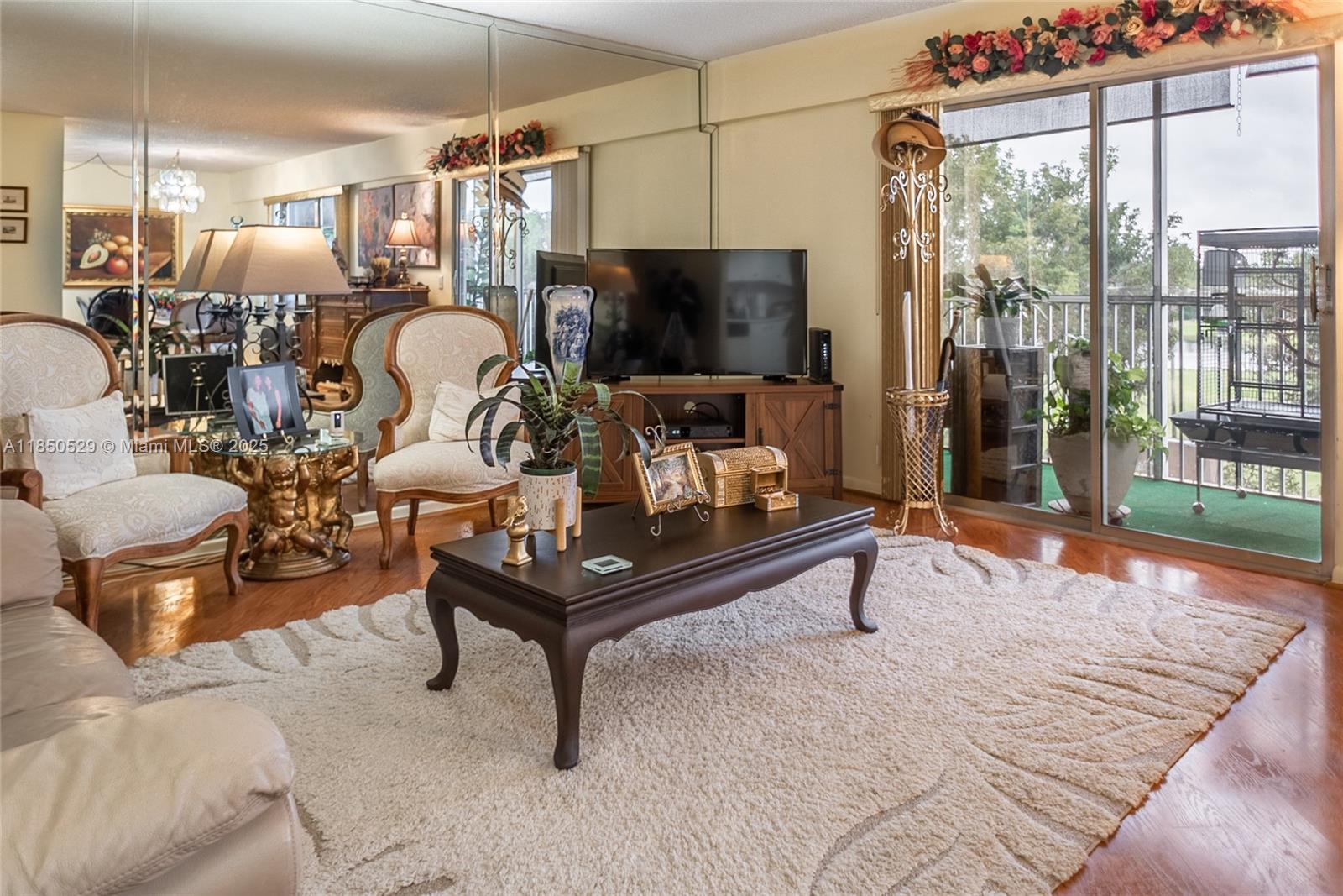 This stunning unit features 1 bedroom, 1 bathroom, white kitchen appliances, and beautiful wood flooring throughout. The community offers a club house, theatre, and even a golf course that you can enjoy viewing from your screened balcony. Whether you're looking for a relaxing retreat or a place to entertain friends and family, this condo has it all. Don't miss out on this incredible opportunity to own a piece of paradise in Pembroke.