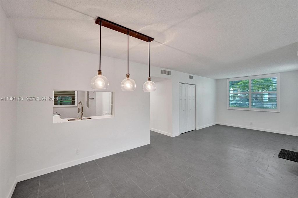 Photo of 9330 Lagoon Pl #109, Davie, FL 33324 (MLS # A11991109)