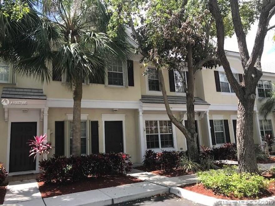 Lovely 2 bedroom townhouse in Jacaranda. Newer wood floors throughout. Patio overlooks peaceful lake view. upstairs bath has roman tub and double sinks. accordion hurricane shutter, new A/C. Quiet community close to shopping, highway and parks.