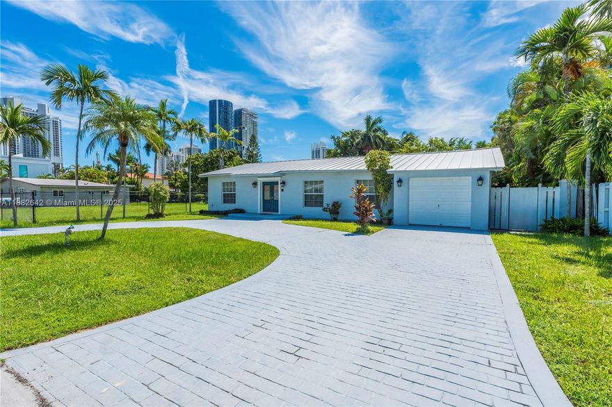 Single family home in good condition in Great Amazing neighborhood of Sunny Isles Beach. 3 bedrooms, 3 baths, Huge in suite with a walk in closet. Tiled & wood floors. Metal roof, tankless electric water heater,  hurricane impact windows. All fans stay. Circular driveway with 1 car garage with lots of parking space. Laundry room, walk right in from garage. Private backyard with patio and storage shed. A+ schools close to the beach & intercoastal. Living area Legally extended in 1998.