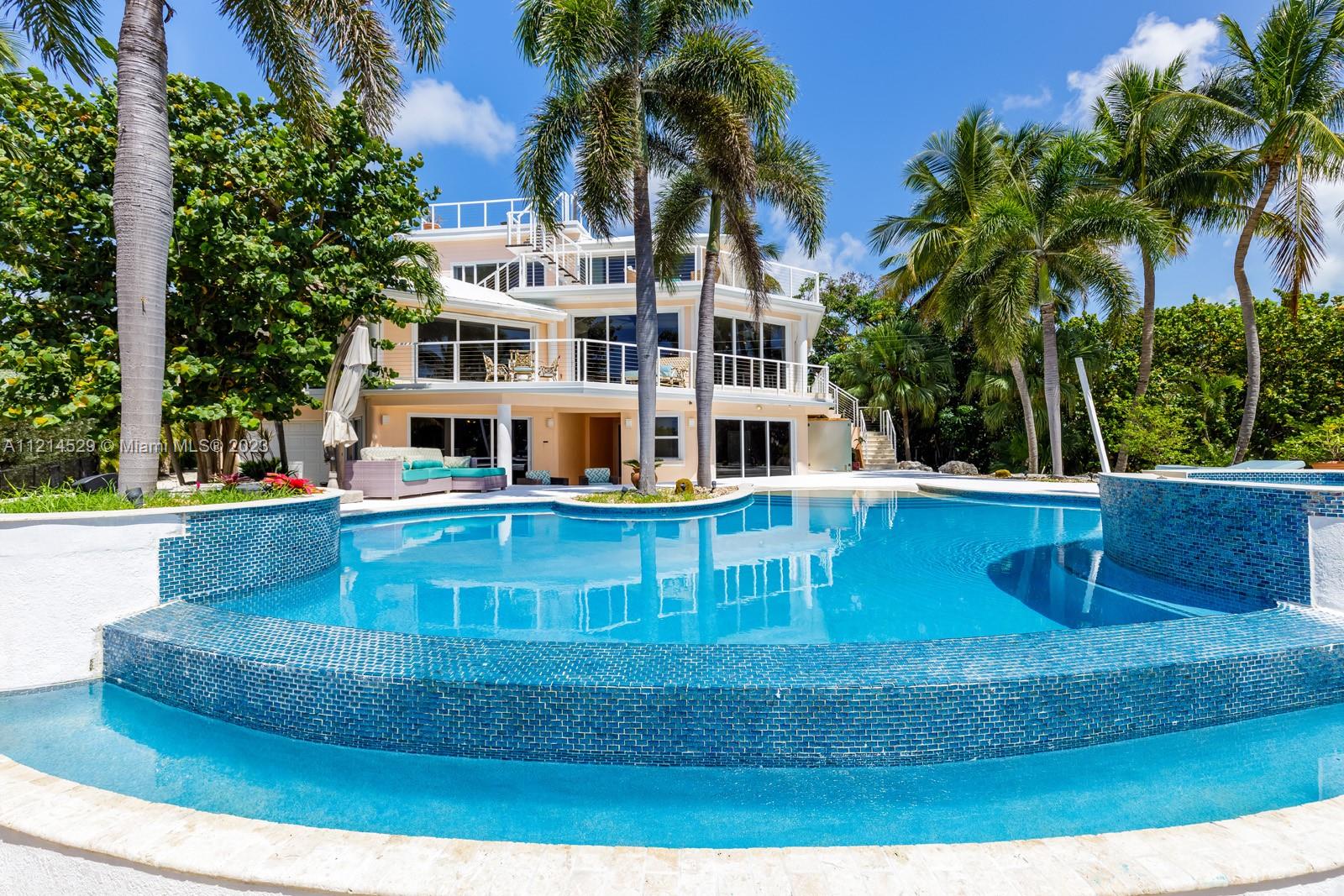 Casa Oceana is a secluded oceanfront estate on Millionaire’s Row that satisfies the senses & eases the soul. With 250 ft. of private oceanfront, 360° roof terrace to watch sunrise or sunset, sweeping ocean views from almost every bedroom, & magically-landscaped 2.2-acre property w. a beach-entry infinity pool, this estate offers resort-style living on a private scale. The large kitchen & family room connect directly to balconies & sitting areas, offering dine-in or out options while entertaining friends & family. The master bedroom boasts 5-star amenities, including an ensuite bath, seating area, bar, fireplace, walk-in closet, & breathtaking ocean views. With an elevator, & 3-car + golf cart drive-thru garage, find your peace at this elegant oceanfront retreat. Zoned 7 day minimum rental.