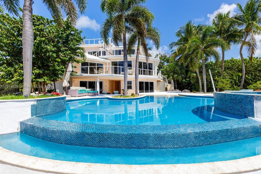 Casa Oceana is a secluded oceanfront estate on Millionaire’s Row that satisfies the senses & eases the soul. With 250 ft. of private oceanfront, 360° roof terrace to watch sunrise or sunset, sweeping ocean views from almost every bedroom, & magically-landscaped 2.2-acre property w. a beach-entry infinity pool, this estate offers resort-style living on a private scale. The large kitchen & family room connect directly to balconies & sitting areas, offering dine-in or out options while entertaining friends & family. The master bedroom boasts 5-star amenities, including an ensuite bath, seating area, bar, fireplace, walk-in closet, & breathtaking ocean views. With an elevator, & 3-car + golf cart drive-thru garage, find your peace at this elegant oceanfront retreat. Zoned 7 day minimum rental.