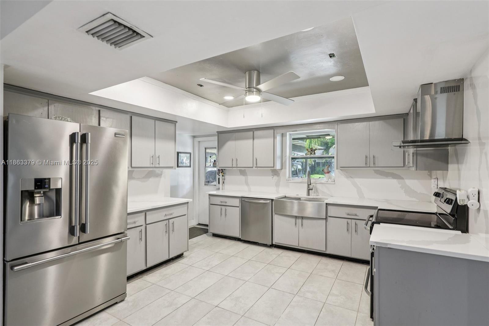 Welcome to a hidden gem in a quiet Fort Lauderdale pocket—this spacious 5-bedroom, 3-bath home offers over 2,500 sq ft of living space on a rare quarter-acre lot. Step inside to find ceramic tile throughout, soft-close kitchen cabinets, sleek quartz Constantine countertops, and a tankless water heater. Electrical and plumbing updates add peace of mind, while French doors open to multiple outdoor living areas, including a private patio. A separate studio with its own entrance, full bath, laundry, and fenced yard is perfect for rental income or guests. Two large enclosed flex rooms offer endless possibilities. No HOA, and the boat ramp is less than 1.5 miles away. Close to restaurants, shopping centers, Colleges/Universities, Highways & more. Live, relax, and explore—it’s all here waiting.