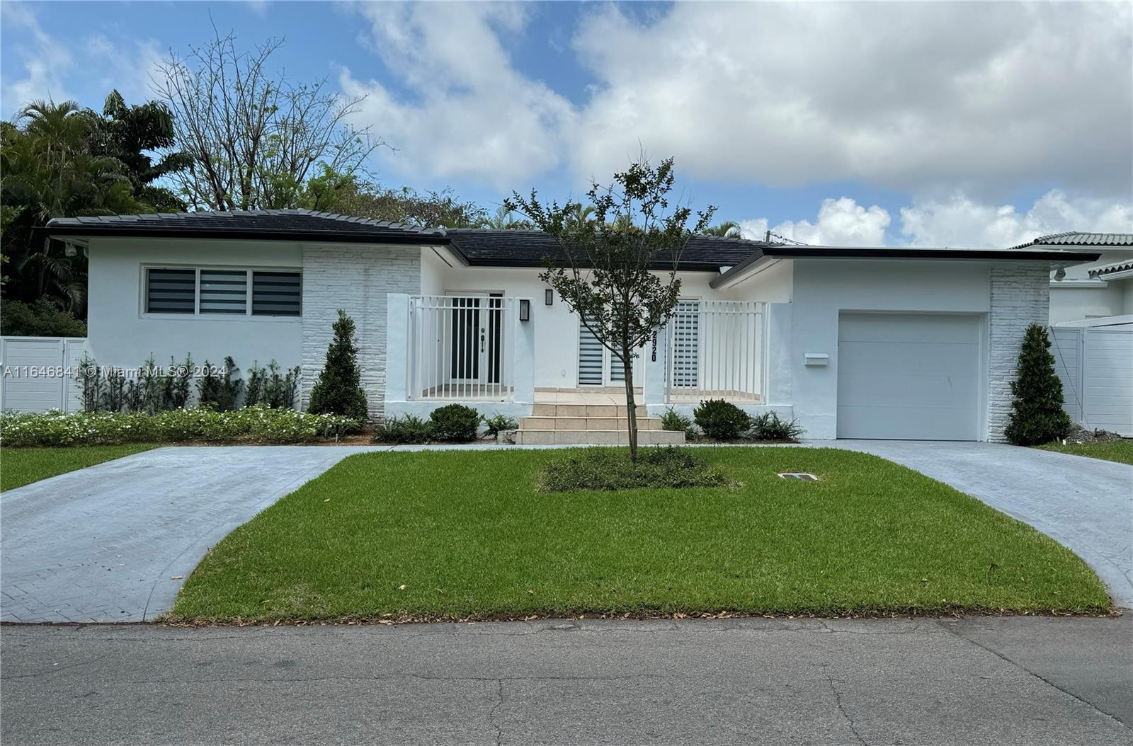 This stunning rental home in Coconut Grove, Miami, offers three bedrooms, two and a half bathrooms, and has been completely renovated to blend modern comfort with style. The heart of the home is the sleek, contemporary kitchen, featuring quartz countertops and top-of-the-line appliances. Large impact-resistant windows flood the space with natural light while ensuring safety and energy efficiency. Additionally, the property features an electric generator, ensuring uninterrupted comfort. Step outside to a spacious covered terrace, perfect for outdoor entertaining or relaxing in a private, serene setting. This home is a perfect blend of luxury and practicality in a prime Miami location, close to restaurants, shopping, downtown.