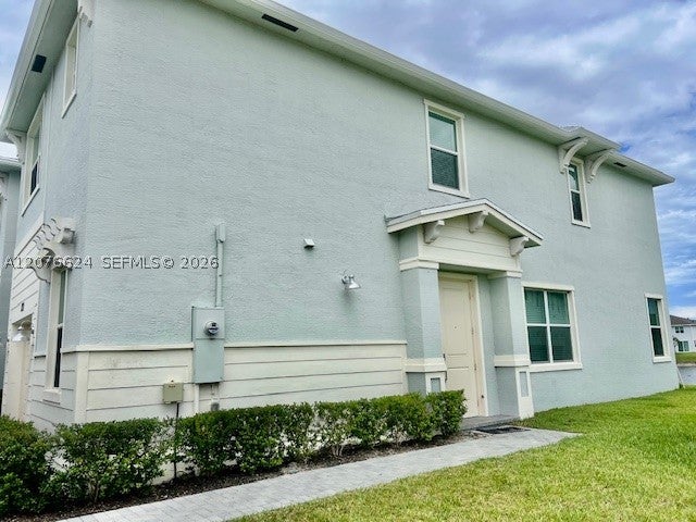 Photo of 871 SE Grovebush Ln, Port St Lucie, FL 34984 (MLS # A12076624)