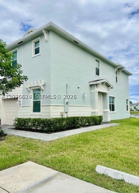 Photo of 871 SE Grovebush Ln, Port St Lucie, FL 34984 (MLS # A12076624)