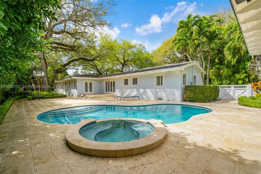 Traditional elegance in Coral Gables. Fully updated and located in one of the area’s most desirable neighborhoods, this residence offers exceptional space and location. Situated on a nearly 22,000 SF lot, it features 4 bedrooms and 5 bathrooms, including a maid’s quarters and laundry area. Bright interiors with wood floors, impact windows, and high-end finishes. The primary suite offers spacious closets, a spa-like bathroom, and pool views. Ideal for comfortable, upscale living. Rent includes: optional fully furnished, golf cart, landscaping, and pool maintenance.