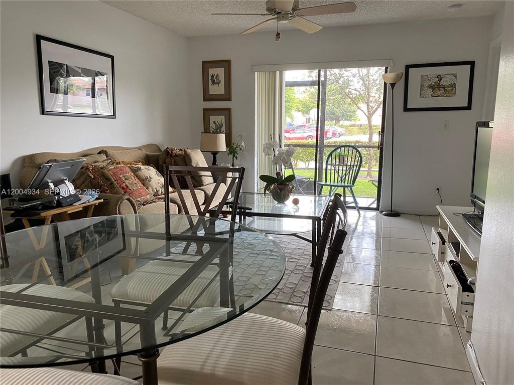 Photo of 10633 NW 10th St #102, Pembroke Pines, FL 33026 (MLS # A12004934)