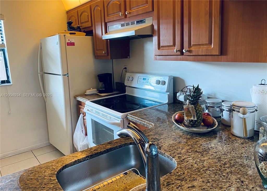 Photo of 10633 NW 10th St #102, Pembroke Pines, FL 33026 (MLS # A12004934)