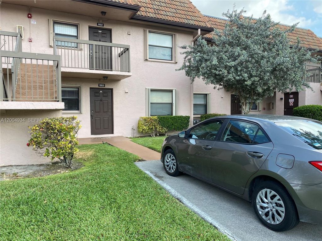 Photo of 10633 NW 10th St #102, Pembroke Pines, FL 33026 (MLS # A12004934)