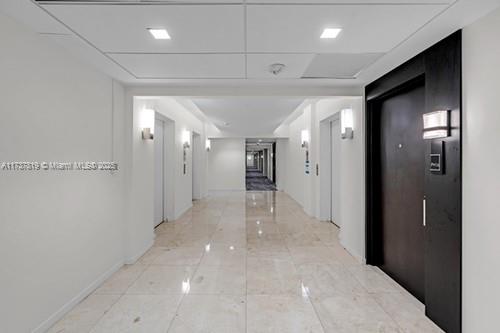 Once in a Lifetime Investment Opportunity in Sunny Isles Beach. Discover luxury in this remodeled 3rd-floor condo at Building B, Oceanview community, near Heritage Park and just steps from the beach. This spacious one-bedroom unit features an ensuite bathroom, a half bathroom, and an open concept layout with high-end upgrades. The redesigned bedroom includes a small office area and a custom walk-in closet with upscale glass doors. Building B boasts updated hurricane impact windows, doors, and balconies. Enjoy resort-style amenities: tennis courts, gym, pool, social room, game room, lounge, and dog-walk area. Located minutes from top restaurants, supermarkets, banks, cafes, and Aventura Mall. This turn-key unit is fully furnished, ideal for investors or first-time home buyers.
