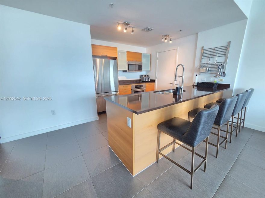 A Floor-to-ceiling 2 Bedrooms + 2 Full Bathrooms condo in the heart of Midtown, an urban design that is reminiscent of New York’s SoHo district with a Miami twist. This condo feature Italian kitchen with stainless steel appliances, custom cabinetry and stone countertops, Spacious walk-in closets, Master baths with ceramic tiled flooring and modern fixtures with 9-foot high exposed concrete ceilings. Pre-wired for cable TV and high-speed Internet. The architecture with its wide expansive wing-like components creates an expansive opening that emphasizes the panoramic views of Downtown and Biscayne Bay. With a modern minimalist lobby, and custom finishes that pay attention to detail 4 Midtown will soon be Miami’s hottest address.