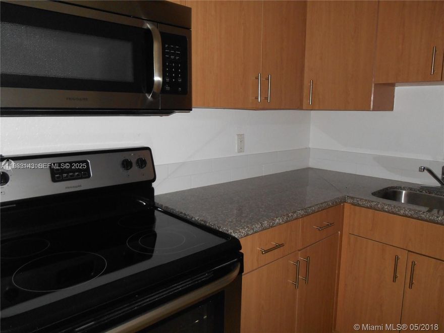 Beautiful 1/1 DORAL GARDENS II, Granite countertop, SS appliances, Pool, Tennis, Lake, Gym. Only FIRST MONTH + ONE MONTH OF SECURITY DEPOSIT + $500 Association Sec. Deposit. Send RENTAL APPLICATION, PROOF OF INCOME, CREDIT REPORT (Minimum 670), ID's, Police Record. Laundry Facilities (2nd floor). ASSOCIATION HAS A RUSH FEE OF $50. NO PETS per Associations Rules.  VACANT, EASY TO SHOW. Showing Assist.