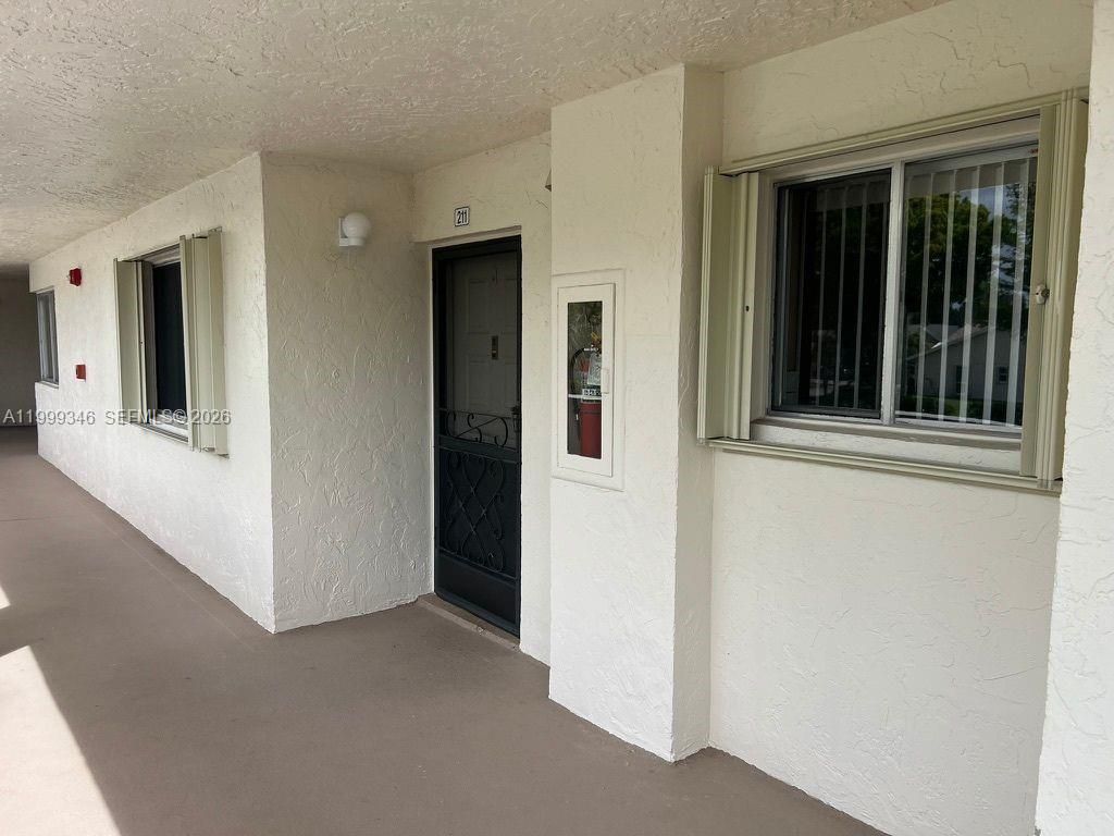 Photo of 3186 Via Poinciana #211, Lake Worth, FL 33467 (MLS # A11999346)