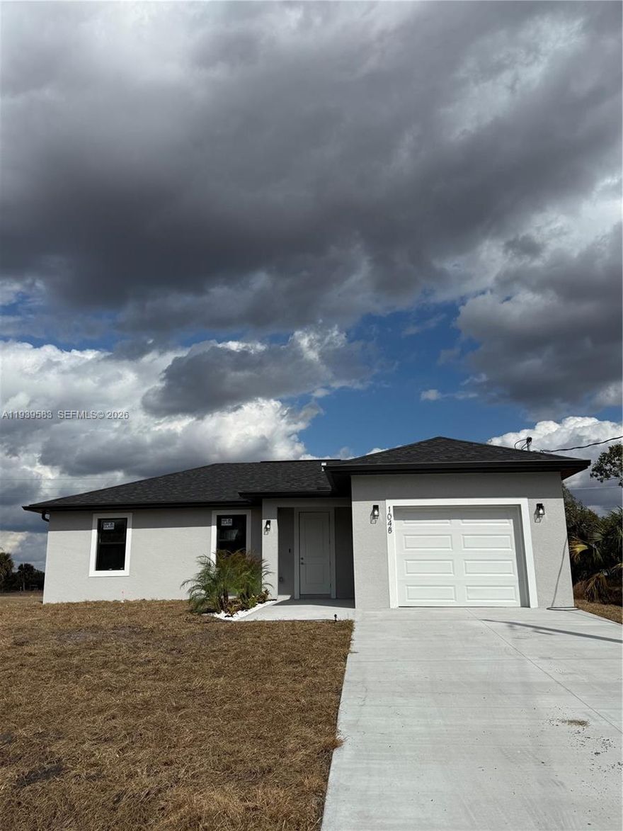 BUYER INCENTIVES AVAILABLE! Welcome to this newly built single-family home in the heart of Labelle, offering modern comfort with a touch of Southern charm. This beautiful residence features 3 bedrooms, 2 bathrooms, and approximately 1,698 sq ft of living space with an open-concept layout. Enjoy a stunning kitchen with quartz countertops, stainless steel appliances, and a peninsula island. The primary suite includes a walk-in closet and elegant en-suite bath with dual sinks and walk-in shower. Energy-efficient windows, 1-car garage, and private backyard. Conveniently located near schools, dining, and recreation. Seller offering $10,000 in incentives!