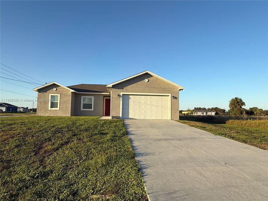 Spectacular house built in 2023. 1 story Single Family Home located in a great community in Port Labelle FI. 4 Bedrooms, 2 full bathrooms2 car garage, 2 bedrooms and a primary suite with large walk-in closet, his & hers sinks, tiled shower, granite counters in bathrooms and kitchen, center island, stainless steel energy efficient appliance package. Approximately 1500 SF under air, over 2100 SF total, covered terrace, soft close cabinets, open floor plan, spacious living room, vaulted ceilings, Bay for 4 cars, Great Backyard! Move-In ready!