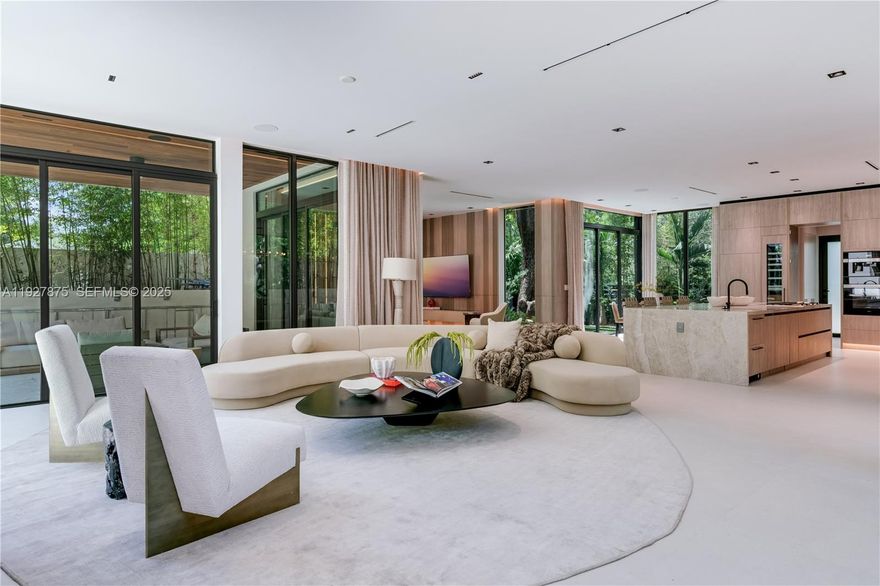 Welcome to CASA GRANDE, a dramatic 7BD/7BA modern residence positioned on a premium corner lot in the heart of Coconut Grove. Designed by Bernardo Paredes and developed by the Modd Group, this architectural showpiece blends bold contemporary design with exceptional comfort and functionality. A grand double-height foyer with a striking sculptural floating staircase sets the tone for the sophisticated interiors. The main level features an expansive living room, formal dining area, and a state-of-the-art chef’s kitchen with premium appliances and a spacious walk-in pantry. A warm, inviting family room with custom millwork anchors the living spaces, complemented by a dedicated home office, full-size laundry room, 2-car garage, and a serene yoga suite/cabana with its own full bath—ideal for wellness, guests, or flexible use.

Upstairs, the home offers five generous ensuite bedrooms, including a luxurious primary suite, along with a versatile second-floor family lounge perfect for movie nights or relaxing retreats. Designed for seamless indoor–outdoor living, CASA GRANDE opens to a covered terrace with a full summer kitchen, resort-style pool, spa, and lush tropical landscaping that creates a private, tranquil oasis. This residence embodies Coconut Grove luxury at its finest—architectural elegance, thoughtful design, and resort-inspired living all in one extraordinary home. Home is also available turn key furnished, move in ready.