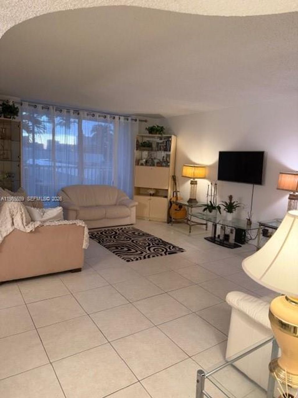 Photo of 100 Golden Isles Dr #201, Hallandale Beach, FL 33009 (MLS # A11955559)