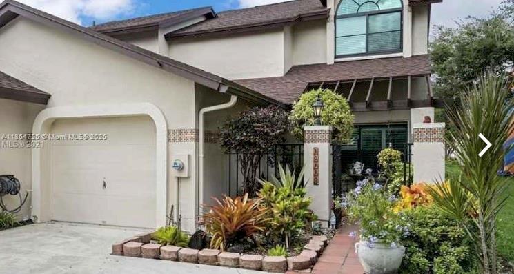 Beautifully maintained 2 Story corner Townhome with a 1 car garage in desirable, gated and secured community of Valencia. Wood floors throughout. Updated kitchen with granite countertop and cabinetry with pull outs, lazy Susan corners and soft close drawers. All new appliances, new A/C with UV Light, Tankless water heater, High Impact energy efficient windows and accordion shutters. California blinds, indoor laundry room and a screened in patio with a full length retractable awning. New roof. This house is a corner unit with an extended driveway. It is located in the heart of Kendall close to all amenities. The neighborhood is quiet and well maintained.