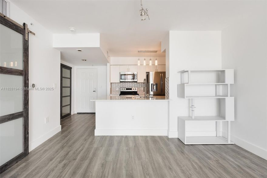 Immerse yourself in the elegance of modern living with this exquisitely updated 1-bedroom apartment in Brickell. Featuring premium appliances, a beautifully renovated bathroom, and sleek tiled floors throughout, this residence boasts a spacious open-concept design that extends to a generous balcony with stunning bay views. Enjoy the convenience of an in-unit washer and dryer, and the luxury of an assigned parking spot. The secure building offers a lobby attendant and valet parking for your peace of mind. Ideally located in the vibrant heart of Brickell, you'll be steps away from trendy restaurants and excellent public transport, promising an unparalleled lifestyle of comfort and convenience.