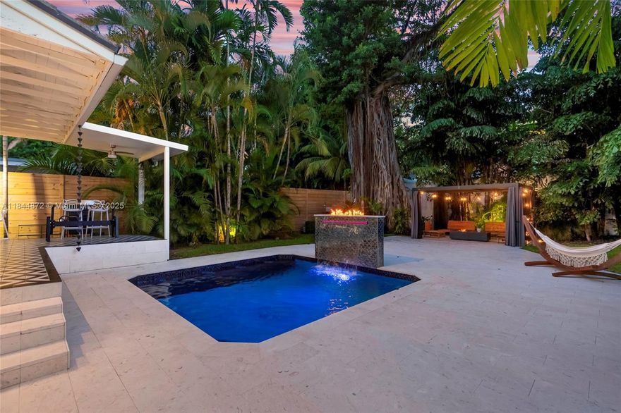 SPECTACULAR home located in the historical & unique single-family sector along S.Miami Avenue in Brickell. Every detail has been thoughtfully considered in this midcentury modern home. The first floor offers formal & informal family spaces that effortlessly lead into the kitchen; the kitchen was carefully designed with earthy tones, high end appliances, storage, and tastefully connects the interior with the exterior allowing for a smooth transition into nature. first and second level offer en-suite bedrooms. The backyard features a heated saltwater pool, with an app-controlled spa featuring a magnificent waterfall feature with overlying fireplace, and a pergola with propane gas fire pit. Additional highlights include a home water filtration, wine cooler & cellar, original wood fireplace.