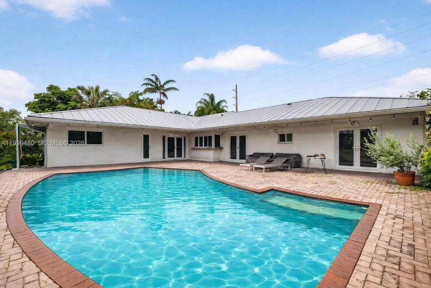 Beautifully maintained home in the heart of Palmetto Bay, offering 4 bedrooms, 2.5 bathrooms and 2,860 SF, set on a lush 18,750 SF corner lot on a quiet, low traffic street.

Features a desirable split floor plan with a private primary suite, tile floors throughout, and abundant closet space. Spacious family room and a well equipped kitchen, perfect for everyday living and entertaining. Laundry room with sink adds convenience.

Enjoy your private saltwater pool, ideal for relaxing or hosting year round. Additional highlights include a circular driveway, 2 car garage, and durable metal roof. Gas water heater, washer and dryer.

Located near top rated schools, including Coral Reef Senior High School and Elementary, plus parks, shopping, and dining nearby. 
DU required with offer.