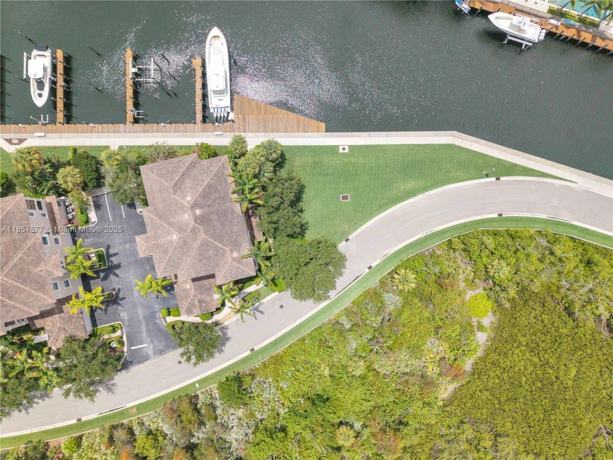 Presenting 13631 Treasure Cove Circle — A thoughtfully designed condo, located in the First Carriage home within the exclusive enclave of Frenchman’s Harbor, Uniquely situated on a desirable corner lot, offering expansive green views, water views, lush landscape and privacy. 3 beautiful bedrooms and 2 full bathrooms, elegant chandeliers and an expansive 45-foot east-facing balcony and a charming west-facing balcony—perfect spaces for relaxing, entertaining, or soaking in tranquil views. The spacious 2-car garage provides access to a secure lobby, where your private elevator awaits to take you exclusively to your unit, ensuring convenience and privacy. The condominium features a private dock equipped with electric and water services, accommodating boats up to 65 feet.