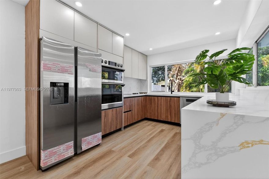 Welcome to this stunning waterfront retreat in the heart of Miramar, fully renovated from top to bottom and ready to impress from the moment you walk in. Soaring ceilings and an abundance of natural light greet you in the expansive open-concept living and dining areas, anchored by wide-plank luxury flooring and designer recessed lighting throughout.
The custom-designed chef's kitchen is a showstopper featuring walnut cabinetry, elegant quartz countertops, new stainless steel appliances, and a wall of windows that flood the space with natural light and serene canal views.
Step outside to your private oasis with a newly resurfaced pool, a dedicated canal-front deck with artificial turf, and direct water views framed by mature tropical palms. Whether you are entertaining or unwinding, this backyard delivers.
Every inch of this home has been thoughtfully upgraded including a new roof, full impact windows and doors, fresh interior and exterior paint, and designer bathrooms featuring floor-to-ceiling tile, matte black fixtures, and striking wood slat accent walls. Truly turnkey with nothing left to do but move in.
Ideally located minutes from I-75, the Florida Turnpike, Pembroke Gardens, and top-rated schools. Homes like this do not last. Schedule your private showing today.