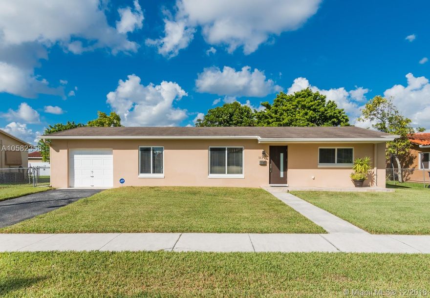 Immaculate, filled with natural light and beautifully renovated 3 bedroom/1 bath home in highly coveted neighborhood that just won't last!  Brilliant, original terrazzo floors throughout, updated kitchen with granite countertops and dark wood cabinetry, gorgeous bathroom and impact glass throughout make this home a winner.  Large back yard has plenty of room for a pool.  Attached, one car garage has separate laundry area with laundry tub. Easy access to Florida's Turnpike, Miami International Airport and shopping.  Easy to show.