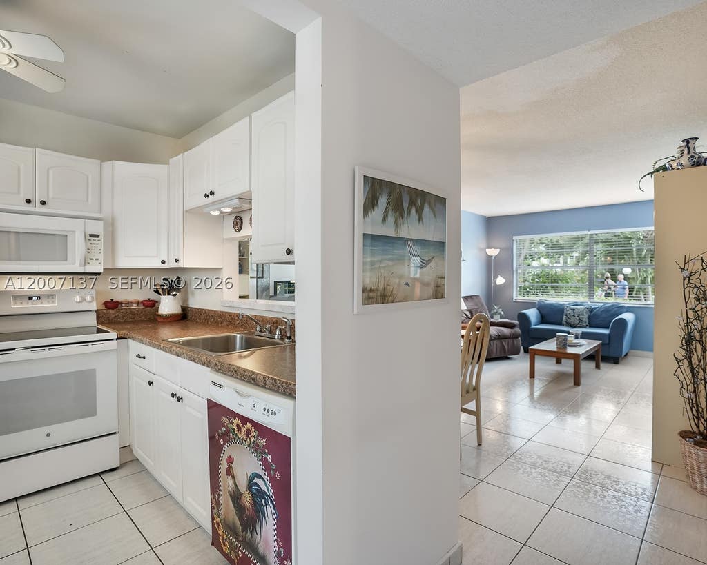 Photo of 5171 W Oakland Park Blvd #106, Lauderdale Lakes, FL 33313 (MLS # A12007137)