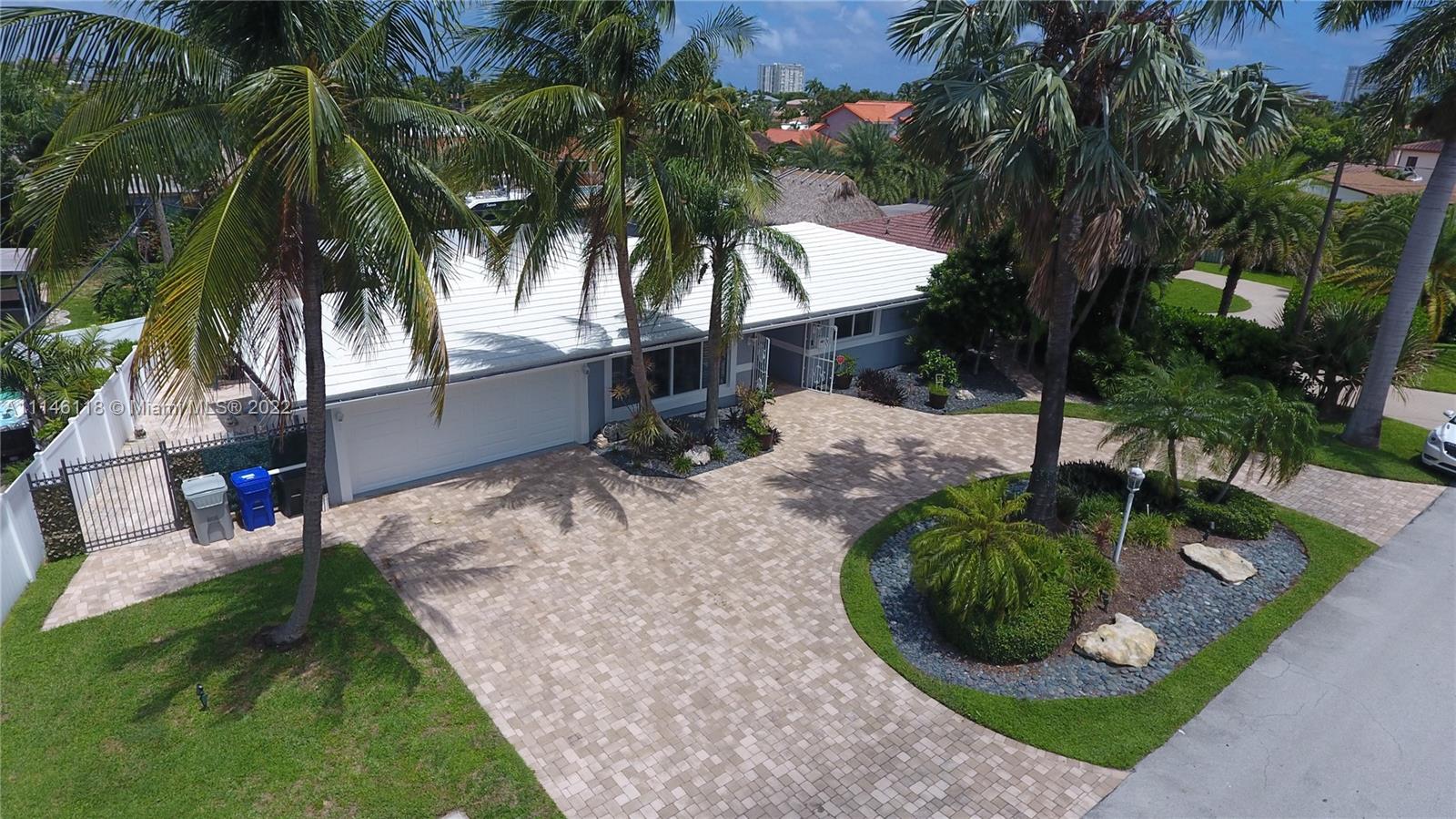 "CASA DE KAI"-MAGNIFICENT TURN KEY WATERFRONT 3 BEDRMS/3BATHS ESTATE HOME*BEAUTIFULLY APPOINTED*MOVE IN READY*ELEGANT SANCTUARY FEATURING DESIGNER FINISHES*FUNCTIONAL FLOOR PLAN W/ A NEWLY RENOVATED POOL & PAVERS*UPSCALE RENOVATED BATHS*ENTERTAINMENT GALORE W/ EXPANSIVE COVERED SCREENED PATIO, DECKING, OUTDOOR FIRE PIT, FISHING FILET STATION, BOAT LIFT & HURRICANE IMPACT WINDOWS*DESIGNER IMPACT ENTRANCE DOOR*GORGEOUS KITCHEN W/SS APPLIANCES &DEEP SS SINK, GRANITE SURFACES & AMPLE AMOUNT OF CABINETS*LARGE WATERFRONT LOT OVER 9K SQ.FT W/70 FT ON WATER, NEWER CIRCULAR PAVER DRIVEWARY, FENCED IN,EAST OF US-1 IN POMPANO ISLES*THIS HOME BOASTS ALL THE FEATURES OF "EASY WATERFRONT LIVING" ACCESSIBLE TO ALL FINE RESTAURANTS, BEACHES, ENTERTAINMENT, PARKS &MORE. A MUST SEE!