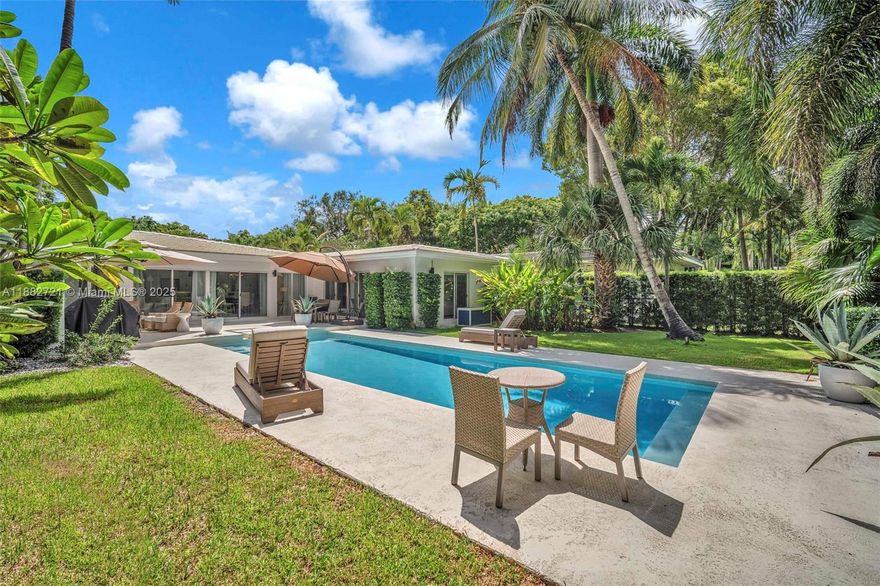 Mid-century tropical oasis located where Coral Gables meets Coconut Grove! This single-story 4-bedroom, 4.5-bath home sits on an oversized 11,900 SF lot with mature landscaping and Royal Palms Designed with an elegant U-shaped floor plan,this home offers beautiful pool & garden views from nearly every room,seamless indoor-outdoor living, and a completely updated modern kitchen. The primary suite includes a spa-like bath, walk-in closet, and direct pool access. Features impact windows & doors,1-car garage, paver driveway, and CBS construction.Offered furnished and also available for short-term rental, ideal for seasonal living or relocation. Prime location near top schools, marinas, parks, and dining,all in a non-flood zone.A turnkey opportunity in one of Miami’s most desirable neighborhood