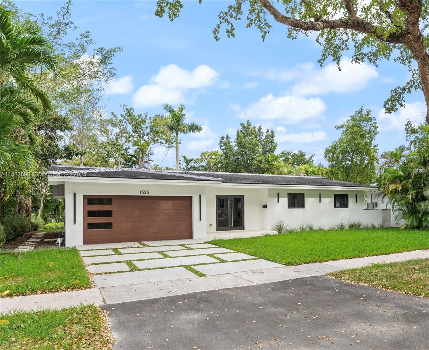 Beautiful One-Story contemporary Gables Riviera home. Completely renovated in 2023! Featuring 4 Bedrooms 3 Baths and 2,542 SQ. FT. of Living Area. New features include: 48x48 Italian porcelain tiles through-out, a perfectly designed chef's kitchen with cooking island, wood cabinets, quartzite counter tops, Bosch appliances, wine cooler, 2 Primary suites w/ensuite primary baths with custom built-in-closets and Indigo Italian doors. Additional property features: 2023 completed tile roof, 2 new electrical 150 AMP Panels, LED lighting, Plumbing, high-impact doors and windows, 3 ton AC units, 2 car garage, new driveway with a lush landscape. Near Riviera Country Club & UM, excellent schools, and shopping, a must see! Call LA Easy to Show!