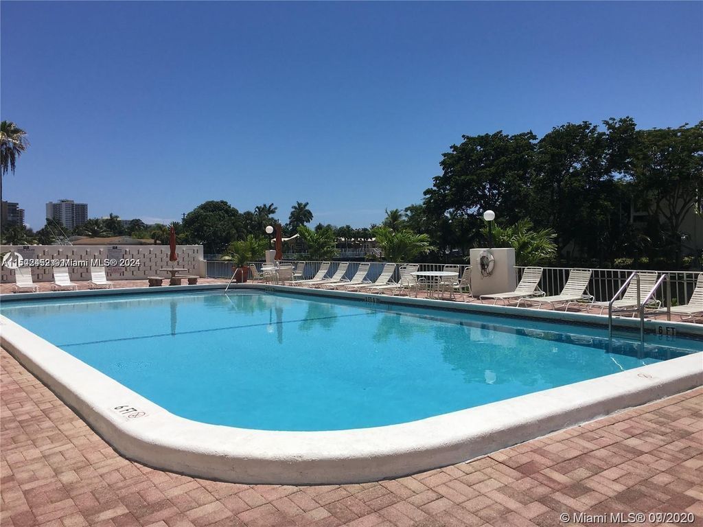 Photo of 401 Golden Isles Dr #1116, Hallandale Beach, FL 33009 (MLS # A11542452)