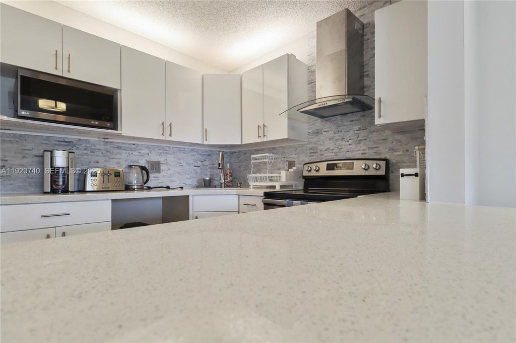 Photo of 313 Knotty Pine Cir #A-2, Green Acres, FL 33463 (MLS # A11929740)