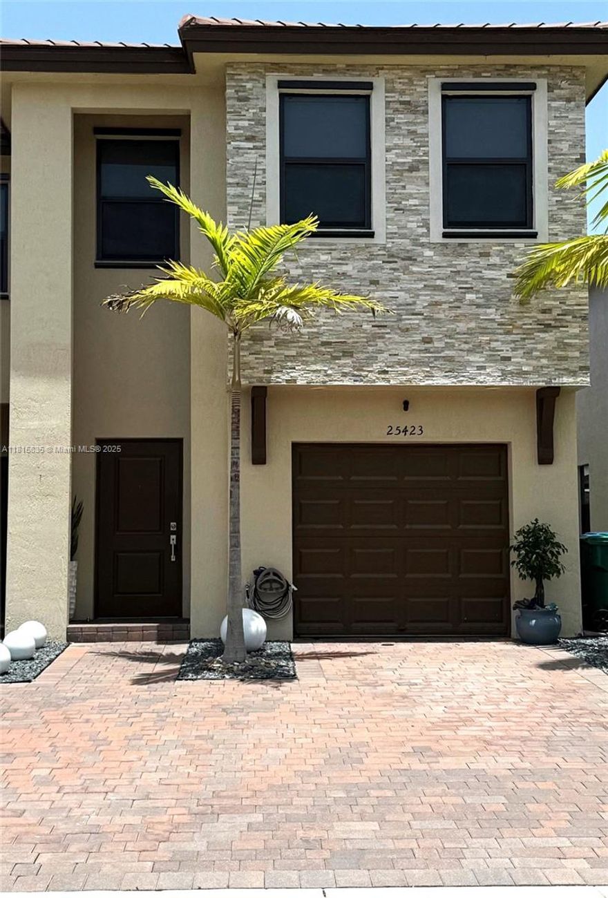 Love the South Florida Lifestyle but think it's financially unattainable? Think again! This 4-bedroom, 3.5-bath Lot & Block Single Family (attached) modern & streamlined home lets you enjoy daytime family barbecues with romantic hot tub nights. The low-maintenance backyard of artificial grass & concrete means no lawn mowing for you, including HOA-maintained front lawn. It also features a covered patio, wood privacy fence, one-car garage with brick pavers driveway, vaulted ceilings,10-foot kitchen island with lots of storage, SS kitchen appliances, ceramic tile 1st floor & luxury vinyl planks on 2nd, SS washer & dryer, hurricane shutters, & more. NO HOA buyer application or approval required, with clubhouse pool playground, hot-tub & gym with a tankless water heater
