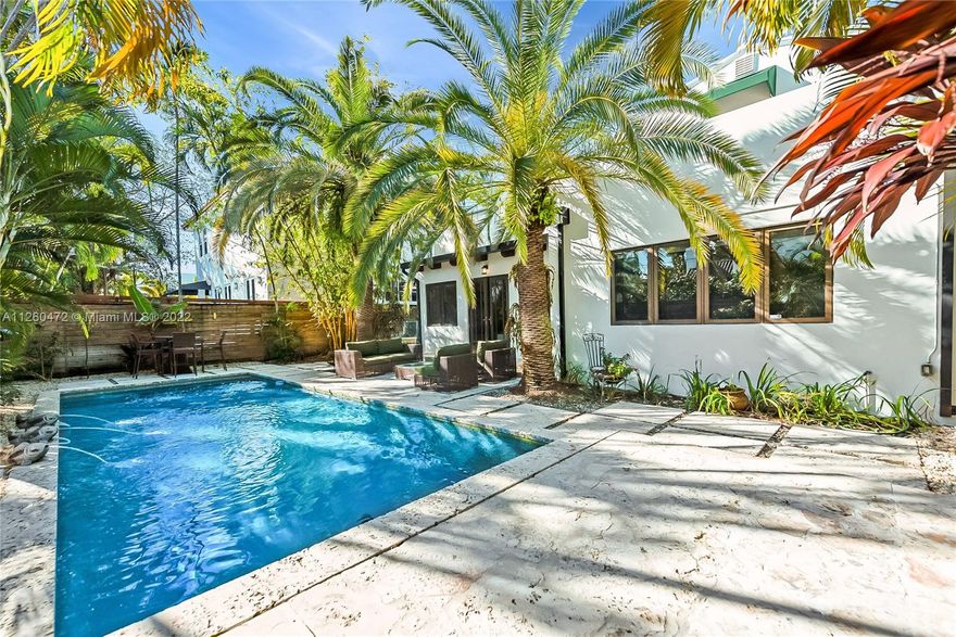 Lovely, gated Art Deco home (circa 1934) on prestigious North Bay Road. Walk to trendy shopping & dining in Sunset Harbour and on world famous Lincoln Rd. Elegant double-height foyer opens to light-filled living spaces featuring classic architectural details including fireplace, wood flooring, custom built-ins & vaulted/wood beamed ceilings. Updated custom kitchen w/wood cabinetry, stone countertops, cooking island & high-end appliances. Ideal floorplan layout offers 4BR/4 + large office. One car garage. Enjoy outdoor living & entertaining in the zen-like, ultra-private backyard with stunning pool surrounded by coral rock pavers and lush tropical landscaping. Just minutes to Wynwood, the Design District, MIA & downtown Miami.