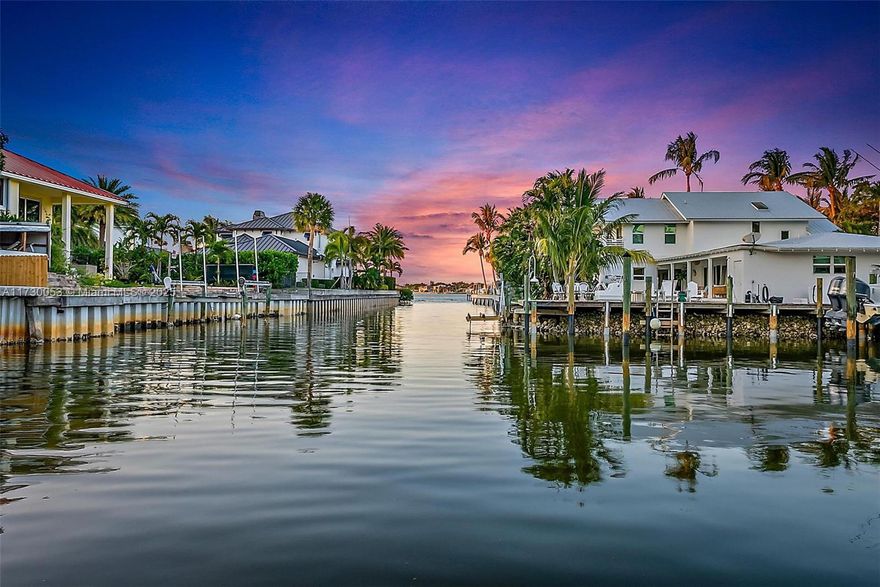 One of the most sought-after canal properties in Jupiter. Welcome to 934 Penn Trail, a captivating waterfront residence in the heart of Jupiter, Florida. This single-story home, built in 1986, offers 2357 sq ft of living space, featuring 4 bedrooms and 2 full bathrooms and 2 half bathrooms. Interior highlights include an open floor plan, fireplace and a fully equipped kitchen as well as four comfortable bedrooms. The expansive outdoor space features a deck and patio as well as a screened porch for outdoor entertaining Florida style. Direct canal frontage and ample dock space with no fixed bridges to open water makes for unparalleled boating access. This home is located close to top rated schools, shopping, dining and recreational facilities.
