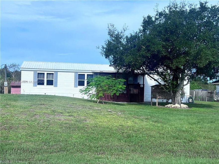 Escape the city and embrace the tranquility of rural life with this charming 3/2 manufactured home located in the heart of LaBelle! Built in 1998, and 1,440 sq. ft. this solid home features a durable metal roof, spacious interior, and sits on half an acre perfect for outdoor enthusiasts, gardeners, or anyone looking for room to spread out. This home is ideal for those who crave peace, privacy, and plenty of yard space. Whether you're dreaming of raising chickens, planting fruit trees, or simply enjoying the stars at night without city lights this home makes it possible.