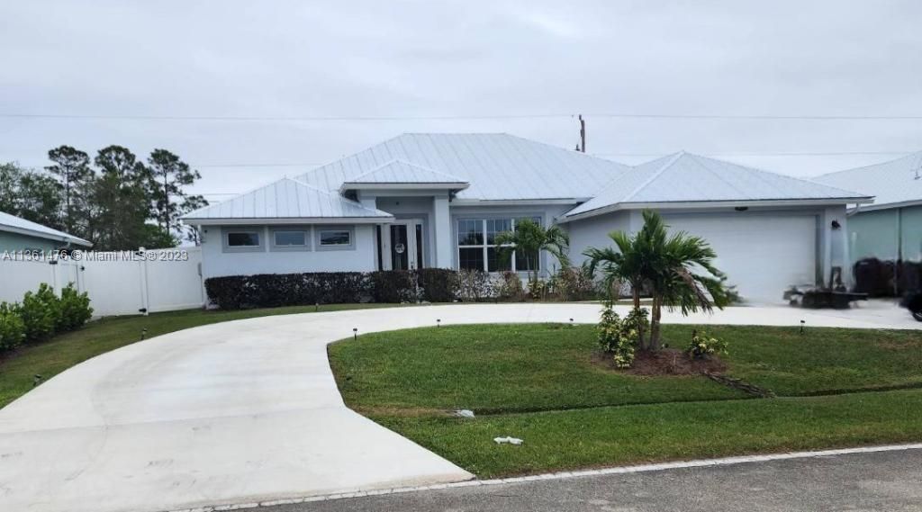 Photo of 4617 SW Savona Blvd, Port Saint Lucie, FL 34953 (MLS # A11361476)