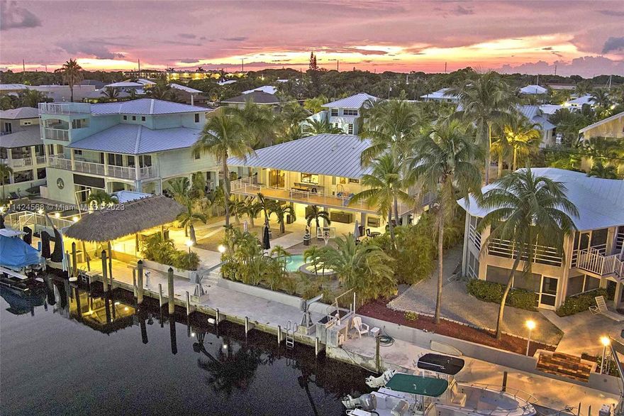 Florida Keys Oasis! Concrete Port Largo home with 75 feet of dockage minutes to the Ocean, pool with integrated hot tub, shady tiki hut for outdoor dining and lush tropical landscaping. Only an hour from Miami but worlds away, this Port Largo home offers an expansive upstairs porch overlooking the water and back yard. With a 3/2 upstairs and a private 1/1 downstairs, this home has the extra space to welcome guests to relax in the Keys. Port Largo also has an oceanfront park with boat ramp (optional association), and the Key Largo Community Park minutes away. This county park offers sports courts, jogging trails, pirate ship pool, plus an Olympic-style swimming/diving facility. The neighborhood also includes Key Largo's biggest fish market and several bars and restaurants. Call today!