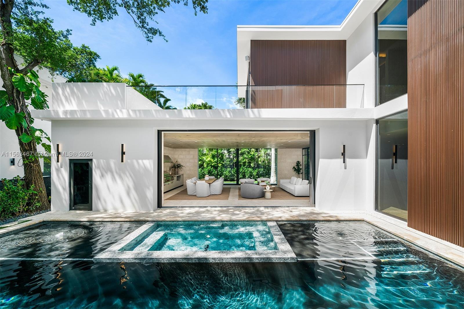 Built by renowned Calta Group, “Villa Unica” seamlessly intertwines rustic elements with a modern architectural design. The 9,065 Sq. Ft. home with 6 bedrooms, 7 full and 1 half bathrooms features an elegant courtyard pool visible from every room around the property and the chef’s kitchen has Mia Cucina cabinetry, a large quartz island, and Sub-Zero and Wolf appliances. The main suite has a walk-in closet, spacious terrace and a ground level walkway. Highlights include an expansive covered entertainment area with an indoor/outdoor kitchen and living area, elevator, and electric vehicle charging ports. Complete with State-of-the-art electronics and security system.