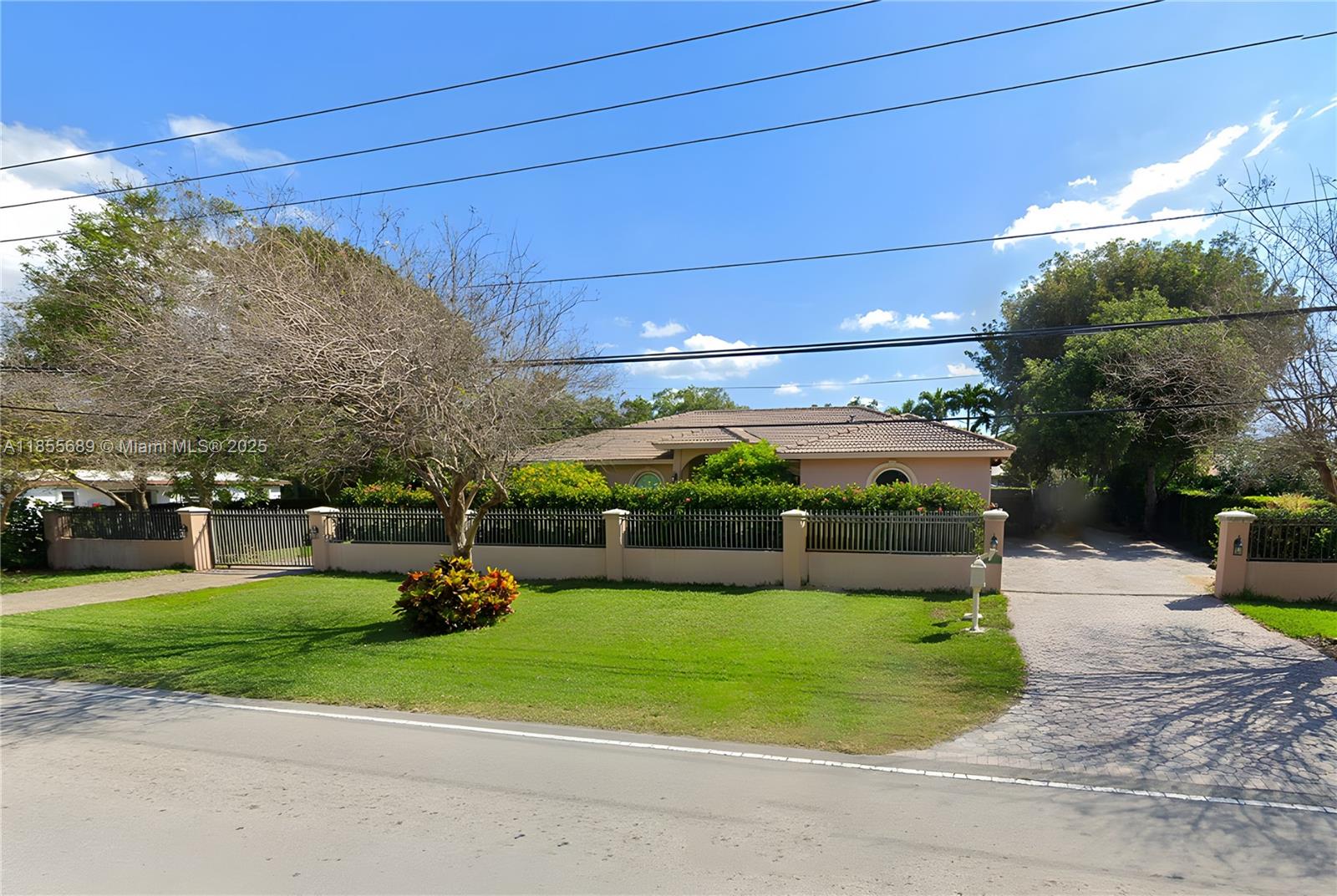 Pinecrest Beauty, 4 bedroom, 3.5 baths has electric gates and circular driveway with pavers. Enter this spectacular home thru the large foyer full of sunlight pouring in through the French doors. Very formal dining and a spacious kitchen with bar style counter tops next to family room and breakfast nook overlooks covered terrace and open pool with fenced in patio. To the left of the home is a Private entrance to all Bedrooms. Huge Primary Bedroom and Primary Bath with views of the beautiful pool. Primary has 2 walk in closets. Spacious inside laundry room along with 2 car garage.