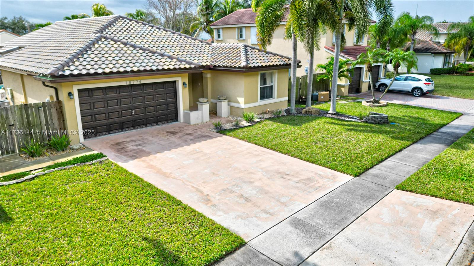 Nestled in a charming and picturesque gated community, this beautiful home offers 3 bedrooms, 2 bathrooms, and a spacious two-car garage. Enjoy the large pool and the privacy of this lovely property, ideally located in the heart of Pembroke Pines. Inside, you'll find tile flooring throughout, an open kitchen with a snack counter, and a cozy dining area. The home also features a brand-new roof. Conveniently close to shopping, top-rated schools, and more, this home is a must-see. The association fee includes basic cable and internet. Don’t miss out on this exceptional opportunity! Make offers seller- motivated.