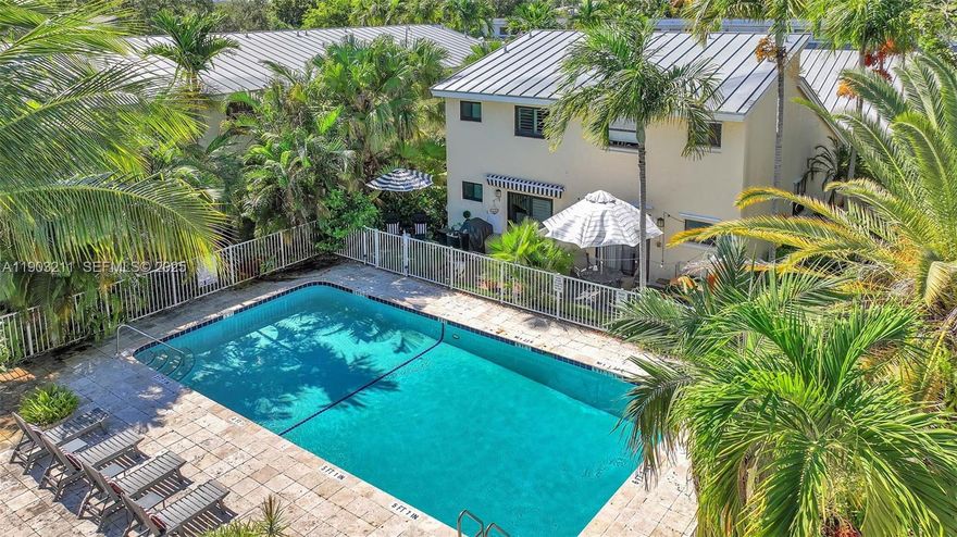 Spacious 2-bedroom, 2-bath loft-style townhome in the heart of East Fort Lauderdale! This light-filled residence features a renovated kitchen with stainless steel appliances and granite countertops, plus two primary suites—one upstairs and one downstairs—each with updated en suite baths. Tile flooring on the first level and laminate upstairs. The versatile loft area is ideal for a home office or TV room. Enjoy in-unit laundry, impact doors, and a private patio surrounded by lush greenery. Fusion Gardens offers a community pool and tropical setting just minutes from Wilton Manors, NE 13th Street, and the beach!