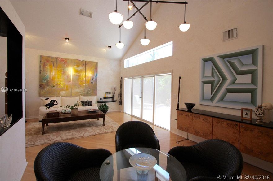 This 3-bedroom, 2.5-bath, 2-car garage home is the most popular single family home model in West Lake Village (the DaVinci). Living room features cathedral ceilings and clearstory windows. Large eat-in kitchen with island opens to family room. Master bedroom has high ceilings. Hard wood floors on first floor, stairs and loft. House sits on a premium, oversized lot (one of the largest in West Lake Village). Yard has a large paver patio, room for a pool and is very private with trees screening the view of back neighbors across the canal. Home is nicely finished and in great condition. West Lake Village is a gated community with tennis, heated pool, hot tub, exercise room, clubhouse, a kid’s play area and 24/7 security gates and patrol. Close to Hollywood Beach and Downtown Hollywood.