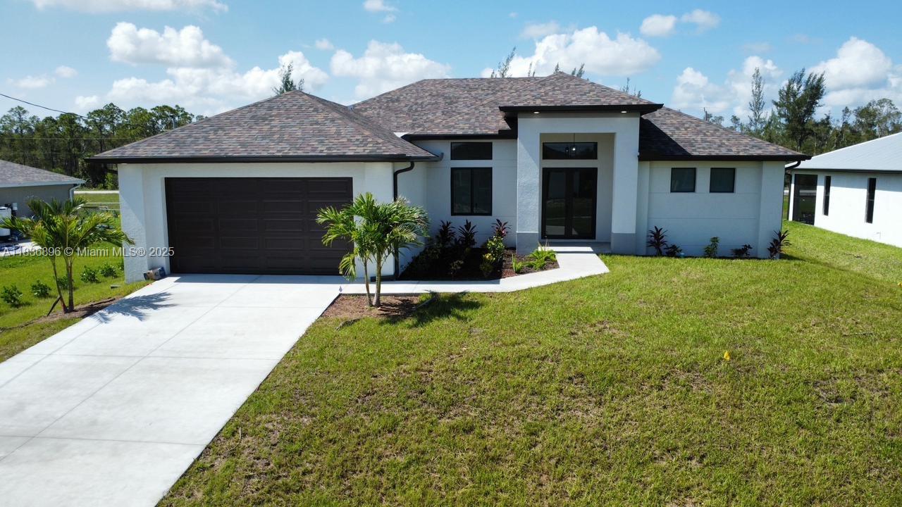 Brand-new construction! Stunning 3 bed, 3 bath home with open split floor plan, 2-car garage, high ceilings, tile floors, and impact-resistant windows/doors. Modern kitchen with quartz countertops, pantry, and French doors. Paver driveway, sprinkler system, and no HOA. Plenty of space to build your dream pool. Located in a fast-growing area of Cape Coral. Move-in ready — schedule your showing today!