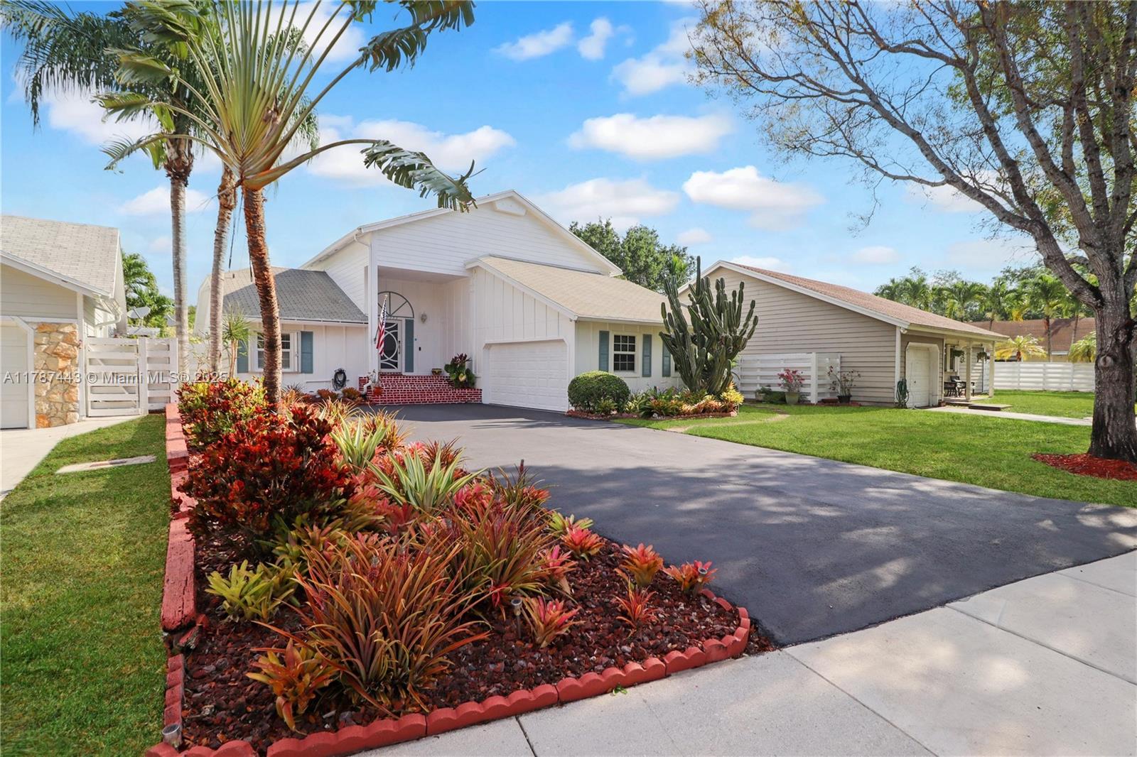 Open the door to your immaculate & spacious Country Walk pool home. Soaring ceilings, with oak wood floors below greet you. The view is a sparkling pool surrounded by tile patio in a tropical setting - Mango tree & palms. 1st floor features a wide-open living/ dining room opening to the pool, an updated eat-in kitchen with newer appliances + incredible cabinetry, half bath, plus an expansive primary suite with ensuite bath. Professional partial conversion of garage creates a family room + laundry & storage. Upstairs, 2 more bedrooms & 2nd full bath. Versatile loft adds open living space. & laundry. The home backs to a wide-open greenbelt. Impact windows & doors, motorized lanai shutters. Long 4-car driveway! Country Walk offers roving patrol, clubhouse, events! Ask about electronics!