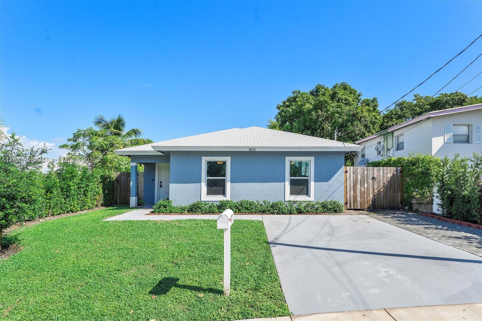 This spacious home features 13-ft ceilings, an open floor plan, and wood-look tile throughout. The kitchen offers granite countertops, stainless steel appliances, and white shaker cabinets. Additional highlights include impact windows, large laundry room, ceiling fans in every bedroom, and a huge fenced backyard with patio. No HOA. Excellent location near beaches, CityPlace, Downtown West Palm, the outlet mall, and I-95. Move-in ready!